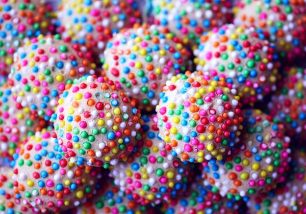 Candies covered in rainbow sprinkles