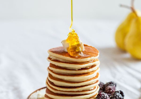 A stack of pancakes with syrup