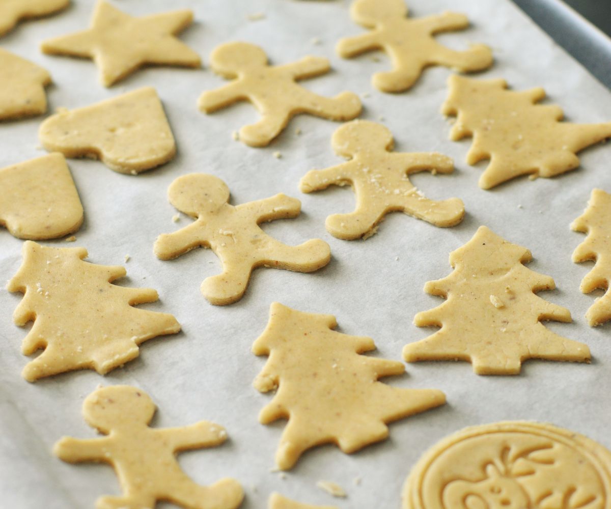 Cut-out gingerbread cookies on a baking sheet