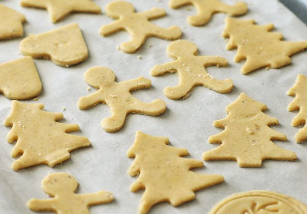 Cut-out gingerbread cookies on a baking sheet