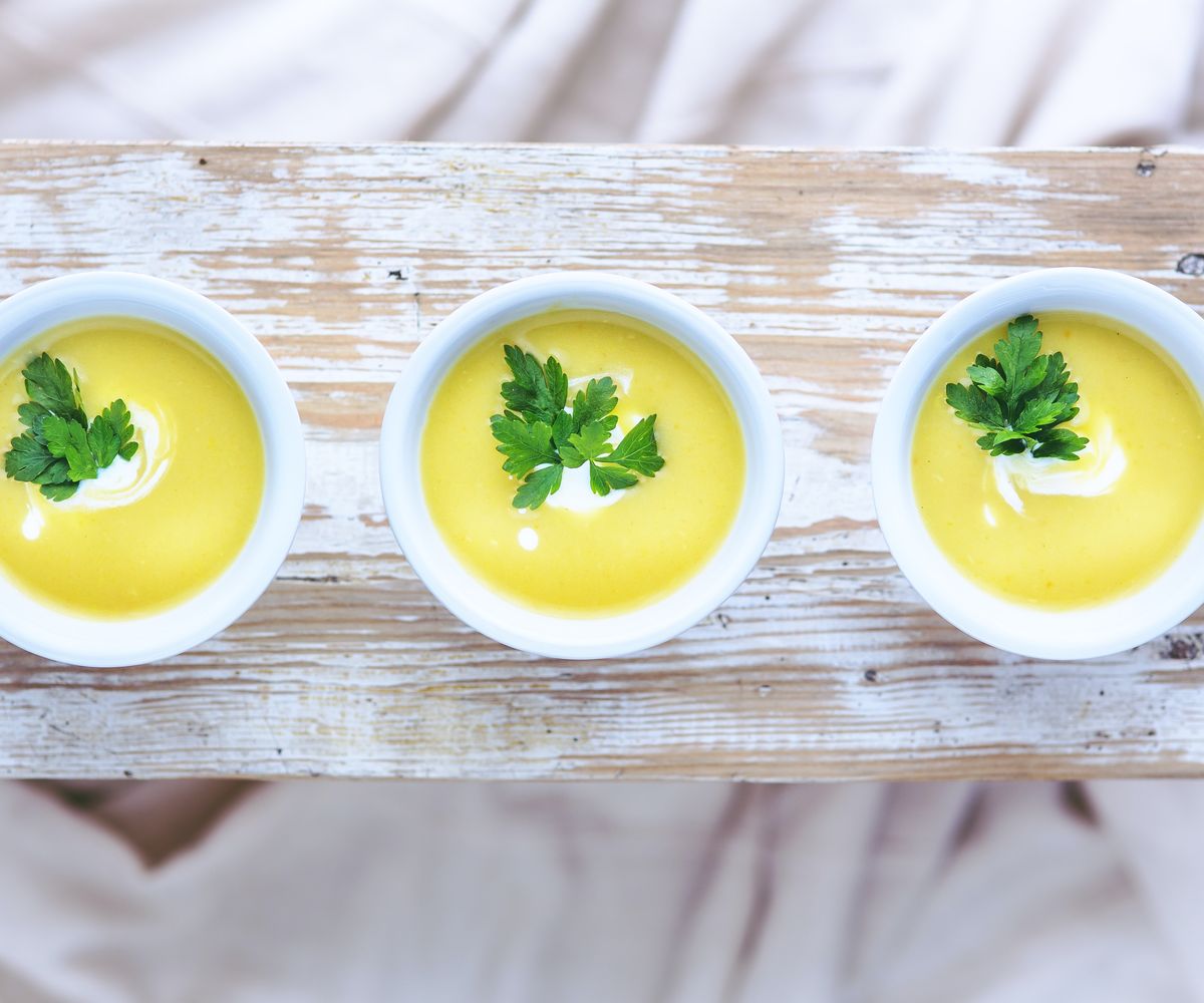 Three bowls of creamy soup
